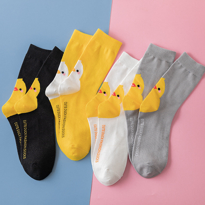 Cute little yellow chicken in tube socks